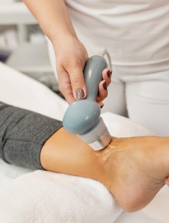 Close-up of tens electrotherapy of patient's joint sprain at medical clinic.