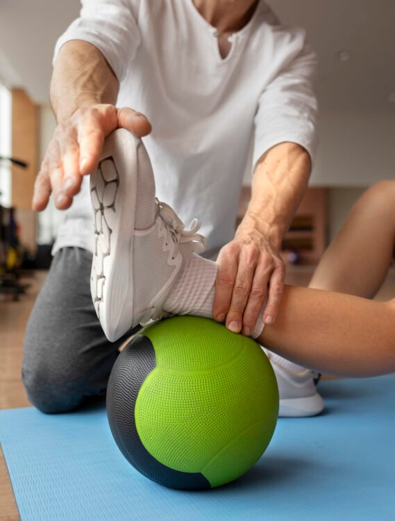 patient-doing-physical-rehabilitation-helped-by-therapists (1)