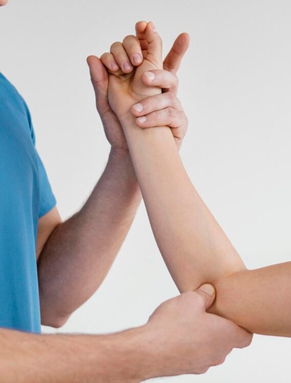 side-view-male-osteopathic-therapist-checking-female-patient-s-elbow-joint.jpg